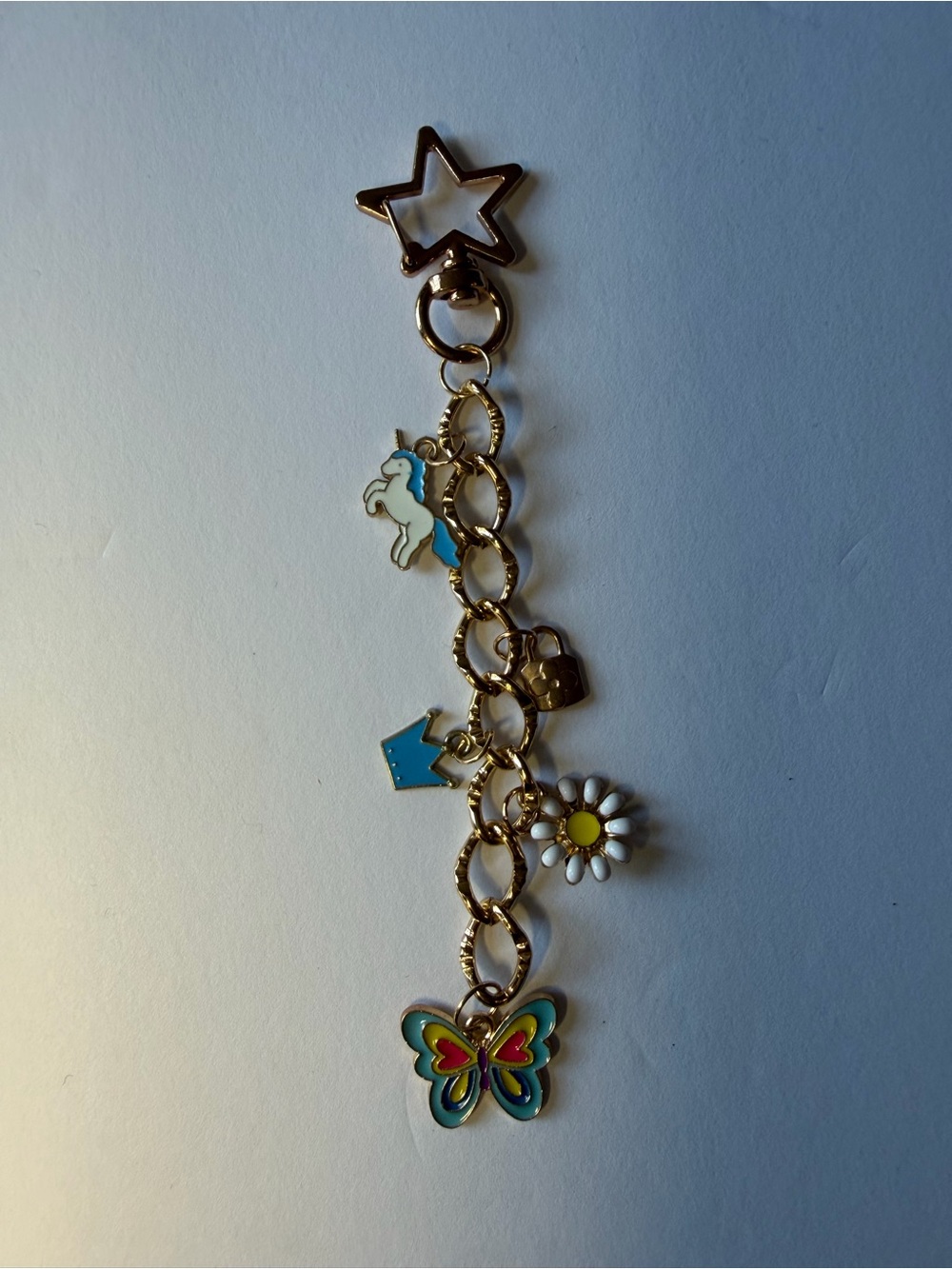 Gold Tone Charm Bag charm with Blue, White and Multicolor Accents